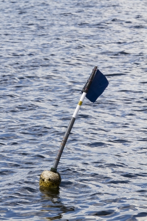 Buoy flag in the seaの写真素材