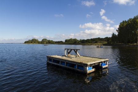wooden raft on water in denmarkの写真素材