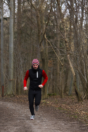A man running outdoors in a forestの写真素材