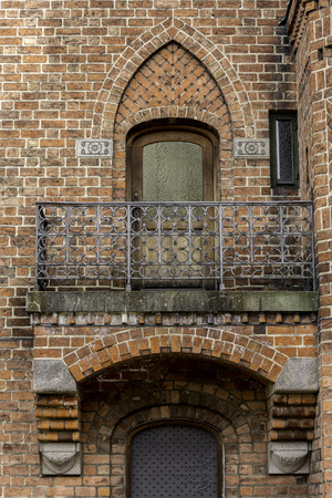 Balcony in red bricks gothic styleの写真素材