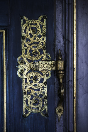 Gpold Ornametal Hinge On A blue Doorの写真素材