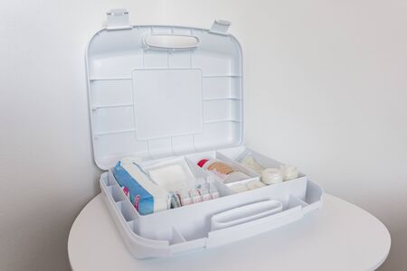 first aid kit with medicines isolated on white backgroundの写真素材