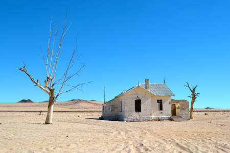 A railway station in Kolmanskop, stands abandoned in the desert, in the sand, Namibia.の写真素材