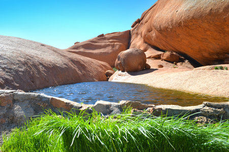 Spitzkoppe area with beautiful rock formations, arches, lakes between rocks in Damaraland Namibia.の写真素材