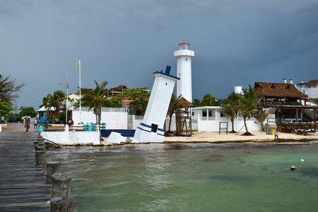 Puerto Morelos, Mexico - September 10, 2021: Tilted Faro Inclinado lighthouse in Puerto Morelos at...