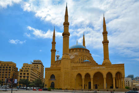 The Mohammad AlAmin Mosque or Blue Mosque with four minarets, in the background is the church of St. George in Beirut, Lebanon.のeditorial素材