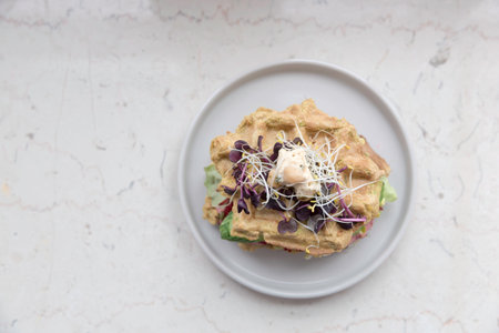 Avocado, keto, low carb waffles with cucumber, beet hummus and sprouts. healthy foodの写真素材