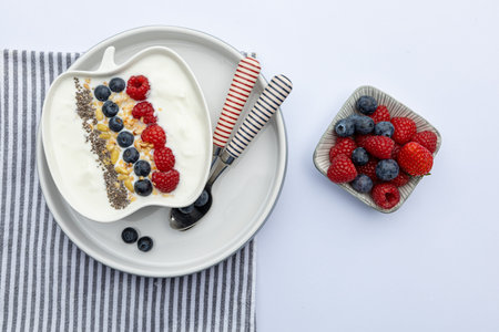 fresh yogurt with fruits,granola, chia seeds und napkin