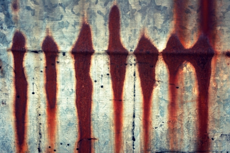 Streaks of rust on a metal baking sheet の写真素材