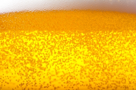 Air bubbles in beer and foam.の写真素材