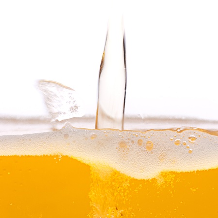 Pouring beer into a mug.の写真素材