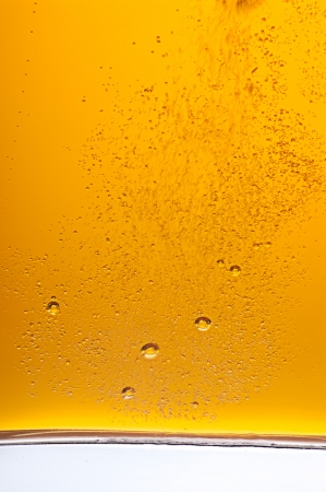 Lots of golden beer bubblesの写真素材