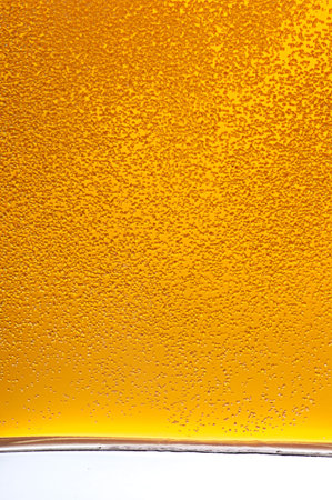Lots of golden beer bubbles