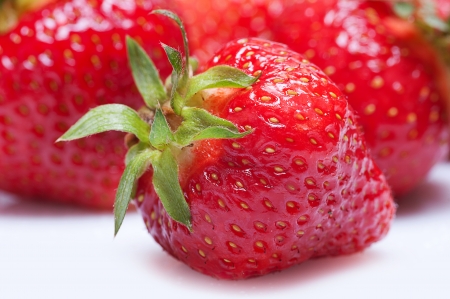 Strawberry with other strawberries.の写真素材