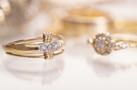 Gold jewelry with diamonds with reflection.の写真素材