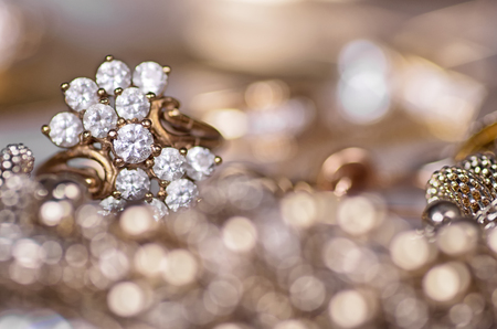 Gold ring on a gold background.の写真素材