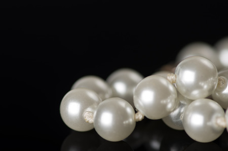 Pearl necklace on a black background.の写真素材