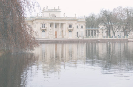 Palace on the Water in Royal Åazienki Park in the autumn fog. Other names include Baths Park Royal Baths Park or Royal Baths.のeditorial素材