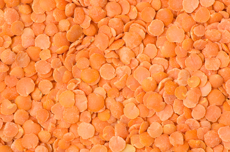 Textured background stacked with lentils.の写真素材