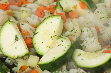 Raw vegetables while frying in a frying pan.の写真素材