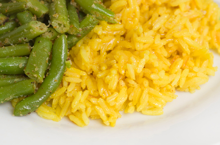 Vegan dinner consisting of risotto and green beans.の写真素材