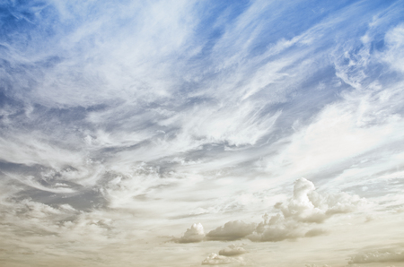 Blue sky with clouds on a sunny summer day.の写真素材