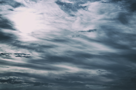 Sky with sun and very dense storm cloudsの写真素材