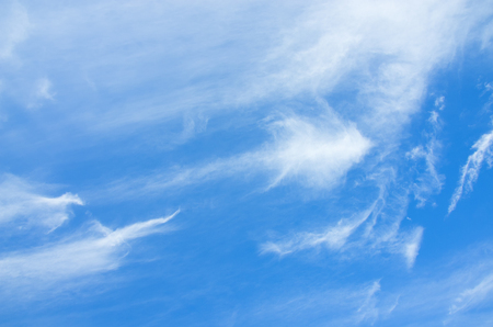 Blue sky with clouds on a sunny summer day.の写真素材