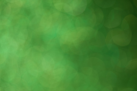 green bokeh abstract light background for Christmas and New Year holidaysの写真素材