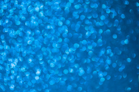 Abstract blue bokeh background. Christmas and New Year concept.の写真素材
