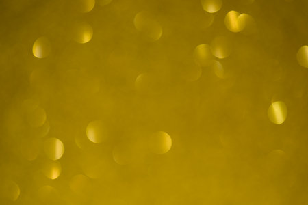Abstract gold bokeh light background. Christmas and New Year concept.の写真素材