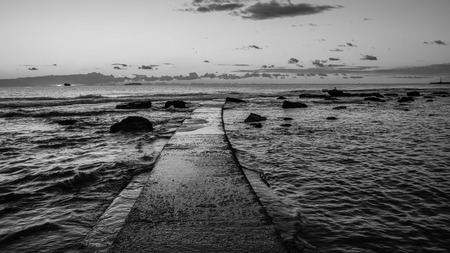 Black and white sunset on the Tuscany sea in front of Leghornの写真素材