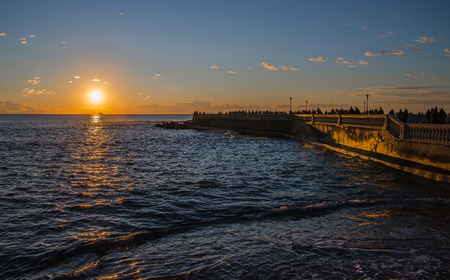 Beautiful winter sunset on the sea in Leghornの写真素材