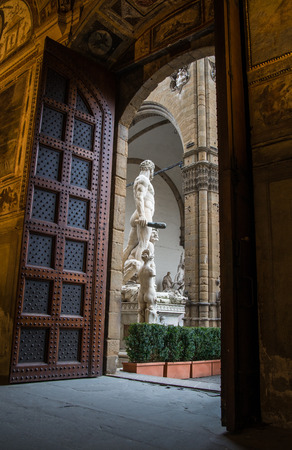 Beautiful foreshortening of Piazza Signoria statue from the main entrance of Palazzo Vecchio in Florenceのeditorial素材