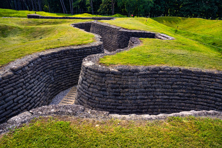 preserved trenches of the first world war at the Canadian Vimy Memorial in Northern France. The former crater landcape is now overgrouwn with grass.の写真素材