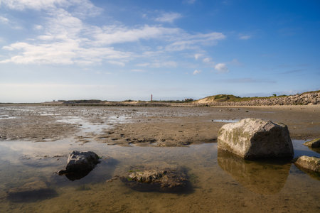 Panorama view of the beach of Berck in France. rock formation and beach in the foreground. Cityscape...