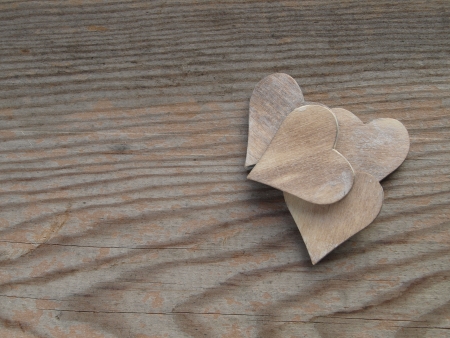 wooden background with heartsの写真素材
