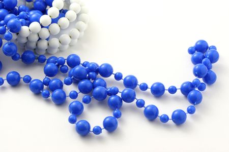 Blue beaded necklace isolated on pure white.の写真素材