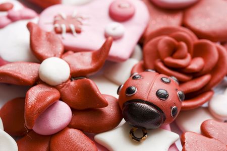 Macro shot of various pink and happy decorations made from clay.の写真素材