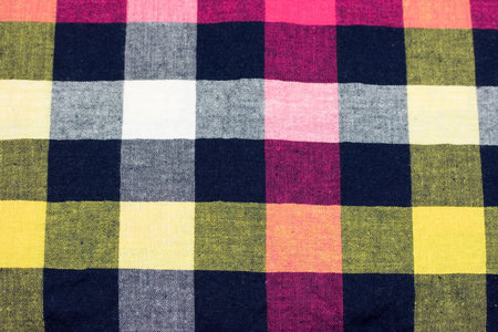 Macro shot of a colorful chequered fabric.