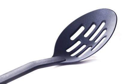 Plastic kitchen utensil on white isolated backgroundの写真素材
