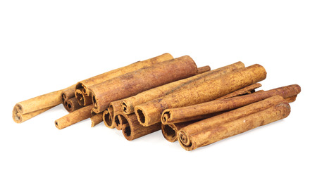 Brown cinnamon sticks on white isolated backgroundの写真素材