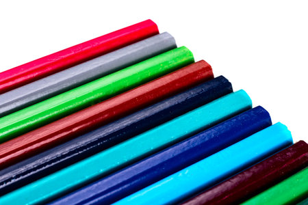Close up colored pencils on white isolated background