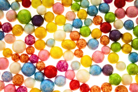 Many nice colorful small polysterene balls on backgroundの写真素材