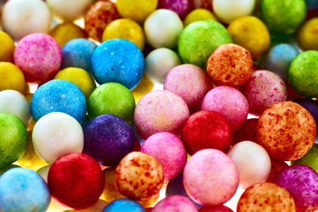 Many nice colorful small polysterene balls on backgroundの写真素材