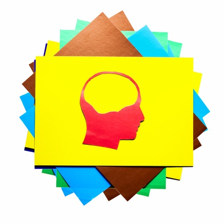 Red paper human head with hollow space on white backgroundの写真素材