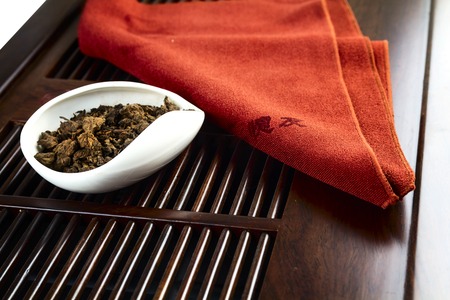 Chinese tea on wood plate background and rice paperの写真素材
