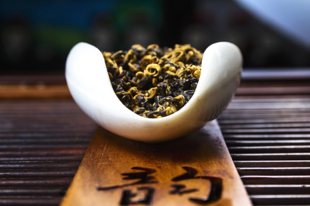 Chinese tea on wood plate background and rice paperの写真素材