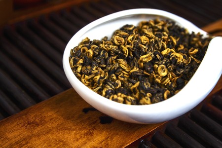 Chinese tea on wood plate background and rice paperの写真素材
