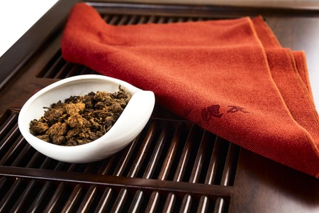 Chinese tea on wood plate background and rice paperの写真素材